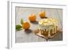 Small Orange Cake with White Icing on Wooden Table-Jana Ihle-Framed Photographic Print