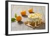 Small Orange Cake with White Icing on Wooden Table-Jana Ihle-Framed Photographic Print