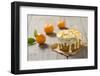 Small Orange Cake with White Icing on Wooden Table-Jana Ihle-Framed Photographic Print