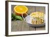 Small Orange Cake with White Icing on Wooden Table-Jana Ihle-Framed Photographic Print