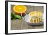 Small Orange Cake with White Icing on Wooden Table-Jana Ihle-Framed Photographic Print