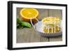 Small Orange Cake with White Icing on Wooden Table-Jana Ihle-Framed Photographic Print