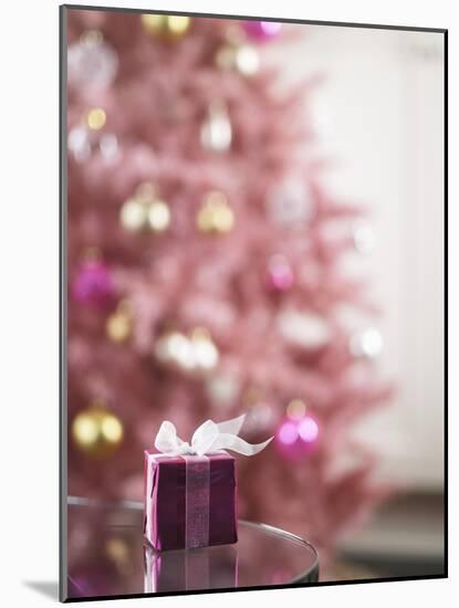 Small Pink Gift Box on Edge of Table-Ryan Mcvay-Mounted Photographic Print