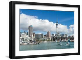 Small sailboats cruise in Auckland harbour in front of the city skyline, Auckland, New Zealand-Logan Brown-Framed Photographic Print