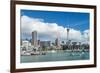 Small sailboats cruise in Auckland harbour in front of the city skyline, Auckland, New Zealand-Logan Brown-Framed Photographic Print