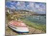 Small Unturned Boat on Quay and Small Boats in Enclosed Harbour at Mousehole, Cornwall, England-Neale Clark-Mounted Premium Photographic Print