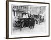 Smart Edwardian Gentleman in a Topcoat and Bowler Hat Rests a Heavy Parcel-null-Framed Art Print