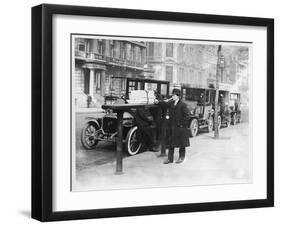 Smart Edwardian Gentleman in a Topcoat and Bowler Hat Rests a Heavy Parcel-null-Framed Art Print