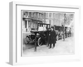 Smart Edwardian Gentleman in a Topcoat and Bowler Hat Rests a Heavy Parcel-null-Framed Art Print