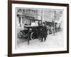 Smart Edwardian Gentleman in a Topcoat and Bowler Hat Rests a Heavy Parcel-null-Framed Art Print