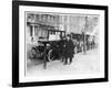 Smart Edwardian Gentleman in a Topcoat and Bowler Hat Rests a Heavy Parcel-null-Framed Art Print