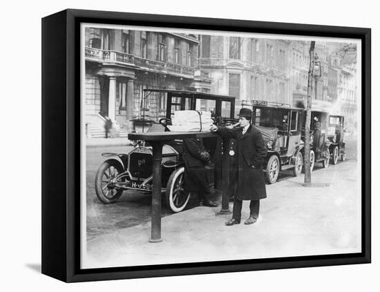 Smart Edwardian Gentleman in a Topcoat and Bowler Hat Rests a Heavy Parcel-null-Framed Stretched Canvas