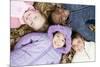 Smiling Children Lying on Autumn Leaves-Ian Boddy-Mounted Photographic Print