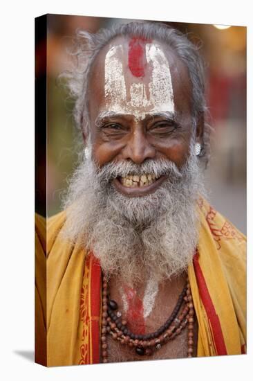 Smiling sadhu with Vishnu mark on his forehead, Rishikesh, Uttarakhand, India-Godong-Stretched Canvas