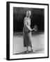 Smiling Woman Playing Tennis-null-Framed Photo