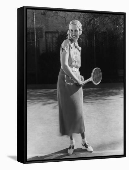 Smiling Woman Playing Tennis-null-Framed Stretched Canvas