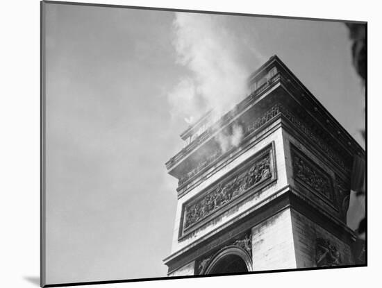 Smoke from Snipers atop Arc De Triomphe-null-Mounted Photographic Print