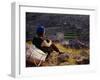 Smoking Her Pipe, a Naxi Woman Rests after Crossing a Precarious Pipe Bridge High Above the Yangtse-Amar Grover-Framed Photographic Print