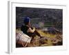 Smoking Her Pipe, a Naxi Woman Rests after Crossing a Precarious Pipe Bridge High Above the Yangtse-Amar Grover-Framed Photographic Print