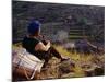 Smoking Her Pipe, a Naxi Woman Rests after Crossing a Precarious Pipe Bridge High Above the Yangtse-Amar Grover-Mounted Photographic Print