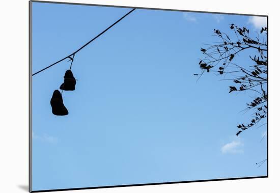 Sneakers on a Wire-null-Mounted Poster