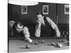 Snooker Player Prepares to Play a Shot as His Partner Looks On-null-Stretched Canvas