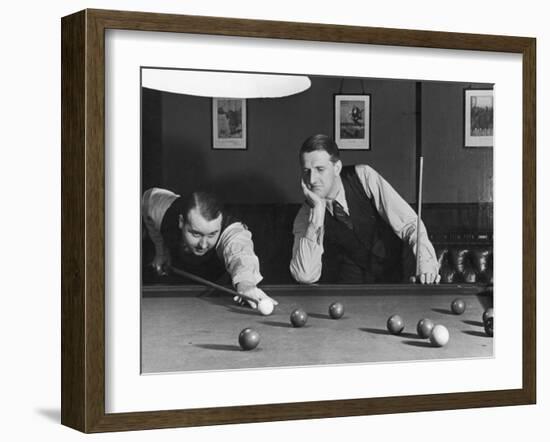 Snooker Player Prepares to Play a Shot as His Partner Looks On-null-Framed Photographic Print