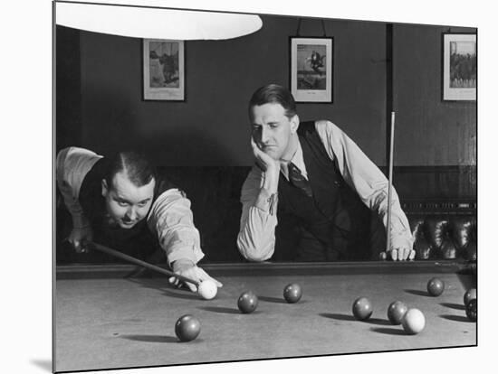 Snooker Player Prepares to Play a Shot as His Partner Looks On-null-Mounted Photographic Print