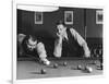 Snooker Player Prepares to Play a Shot as His Partner Looks On-null-Framed Photographic Print