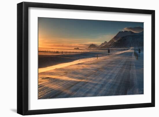 Snow Blows across an Icelandic Road at Sunrise with Mountains Looming in the Distance-Alex Saberi-Framed Photographic Print