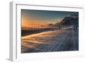 Snow Blows across an Icelandic Road at Sunrise with Mountains Looming in the Distance-Alex Saberi-Framed Photographic Print