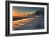 Snow Blows across an Icelandic Road at Sunrise with Mountains Looming in the Distance-Alex Saberi-Framed Photographic Print