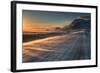 Snow Blows across an Icelandic Road at Sunrise with Mountains Looming in the Distance-Alex Saberi-Framed Photographic Print