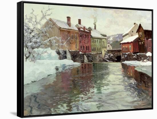 Snow-Covered Buildings by a River-Fritz Thaulow-Framed Stretched Canvas