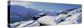 Snow Covered Chapel and Chalets Swiss Alps Switzerland-null-Stretched Canvas