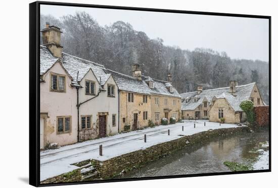 Snow covered houses by By Brook in Castle Combe, Wiltshire, England, United Kingdom, Europe-Paul Porter-Framed Stretched Canvas