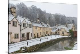 Snow covered houses by By Brook in Castle Combe, Wiltshire, England, United Kingdom, Europe-Paul Porter-Stretched Canvas