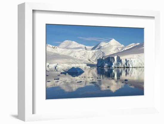 Snow covered island and iceberg with reflection in South Atlantic Ocean, Antarctica-Keren Su-Framed Photographic Print