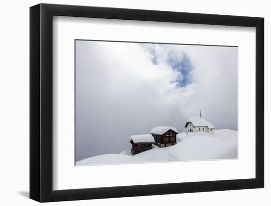 Snow Covered Mountain Huts and Church Surrounded by Low Clouds, Bettmeralp, District of Raron-Roberto Moiola-Framed Photographic Print