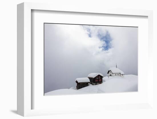 Snow Covered Mountain Huts and Church Surrounded by Low Clouds, Bettmeralp, District of Raron-Roberto Moiola-Framed Photographic Print