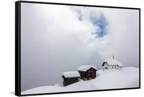Snow Covered Mountain Huts and Church Surrounded by Low Clouds, Bettmeralp, District of Raron-Roberto Moiola-Framed Stretched Canvas