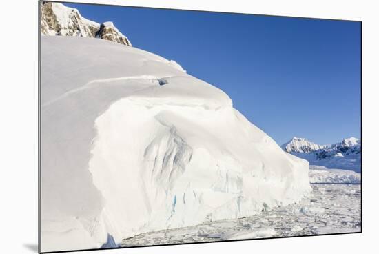 Snow-Covered Mountains Line the Ice Floes in Penola Strait, Antarctica, Polar Regions-Michael Nolan-Mounted Photographic Print