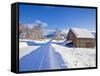 Snow Covered Road, Barn and Chalets in Norwegian Village of Laukslett, Troms, North Norway, Scandin-Neale Clark-Framed Stretched Canvas