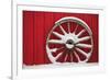 Snow-covered wagon wheels against red barn near town of Banff, Canadian Rockies, Alberta, Canada-Stuart Westmorland-Framed Photographic Print