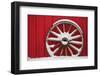 Snow-covered wagon wheels against red barn near town of Banff, Canadian Rockies, Alberta, Canada-Stuart Westmorland-Framed Photographic Print