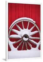 Snow-covered wagon wheels against red barn near town of Banff, Canadian Rockies, Alberta, Canada-Stuart Westmorland-Framed Photographic Print