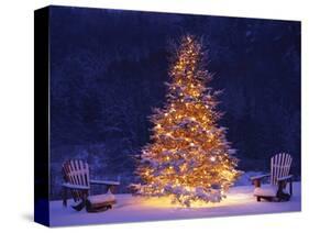 Snow Covering Adirondack Chairs by Lit Christmas Tree-Jim Craigmyle-Stretched Canvas