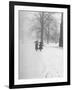 Snow Falling While People Take a Stroll Across Campus of Winchester College-Cornell Capa-Framed Photographic Print