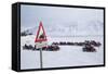 Snow Mobile Traffic Sign in Front of Snow Mobiles-Stephen Studd-Framed Stretched Canvas