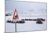 Snow Mobile Traffic Sign in Front of Snow Mobiles-Stephen Studd-Mounted Photographic Print